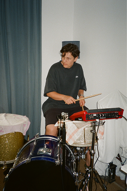 Drummer playing in a room